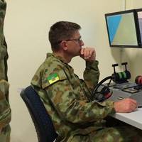 Members of the Australian Defense Force training at one of the 12 NAUTIS desktop stations at the Townsville base