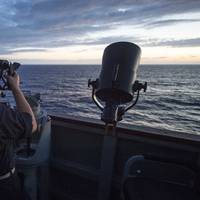 Midshipmen from the U.S. Merchant Marine Academy, fix the ship's position using a sextant aboard the Arleigh Burke-class guided-missile destroyer USS Benfold (DDG 65). (Photo: Deven Leigh Ellis / U.S. Navy)