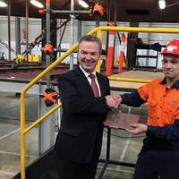 Minister Pynes’ signature was welded into a plate that was in turn welded into the hull by the Minister, with assistance from one of Austal’s newest Apprentice Fabricators, Ricardo De Oliveira. (Image: Austal)
