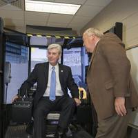 Mississippi Governor Phil Bryant tried his hand in a crane simulator during a tour of Ingalls Shipbuilding’s Maritime Training Academy. Also pictured is Larry Porter, a master trainer at Mississippi Gulf Coast Community College, which partners with Ingalls and the State of Mississippi in administering Ingalls’ apprenticeship program. Photo by Andrew Young/HII
