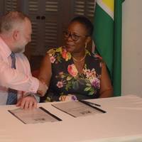 National Hydrographer of the UK Hydrographic Office, Rear Admiral Tim Lowe and Director General of the Maritime Administration Department, Claudette Rogers during the signing of the agreement. Photo: DPI Guyana