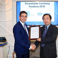 Nick Brown presenting the AiP to Dr Chen Gang at Posidonia  (Photo: Lloyd's Register) 