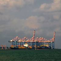 Panorama of Djibouti port with ships and cargo crane - Credit: homocosmicos/AdobeStock