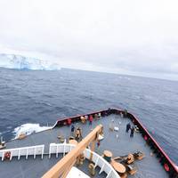 Passengers and the crew of CGC Polar Star gather to observe their first encounter with ice during Operation Deep Freeze 2016 in the Southern Ocean Jan. 3, 2016. (U.S. Coast Guard photo by Grant DeVuyst)