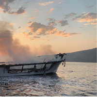 Photo of Conception’s burned hull at dawn on September 2, 2019, prior to sinking. (Credit: Ventura County Fire Department via NTSB)