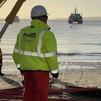 Pioneer Consulting team member oversees the landing of subsea cable. Credit: Pioneer Consulting.