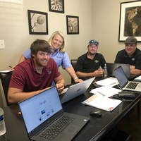 Rachel Aylard, Product Manager for Helm CONNECT Personnel, signs with the Dupre Marine Transportation team (Photo: Helm Operations)