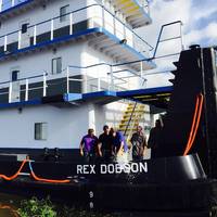 Rex Dobson breaking the traditional bottle over his namesake (Photo: New Generation Shipbuilding)