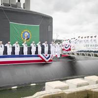 Sailors render a salute during the commissioning ceremony for the Virginia Class Submarine USS Washington (SSN 787) at Naval Station Norfolk. Washington is the U.S. Navy's 14th Virginia-class attack submarine and the fourth U.S. Navy ship named for the State of Washington. (U.S. Navy photo by Class Joshua M. Tolbert)