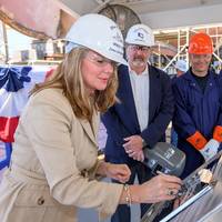 Ship sponsor Christina Calhoun Zubowicz writes her initials onto a steel plate that will be welded inside Calhoun (WMSL 759), the national security cutter named in honor of her grandfather, Charles L. Calhoun. Pictured with Zubowicz are (left to right) George Nungesser, Ingalls Shipbuilding Vice President of Program Management; Christopher Tanner, a structural welder at Ingalls; and Capt. Peter Morisseau, commanding officer, U.S. Coast Guard Project Resident Office Gulf Coast. Photo by Lance Dav