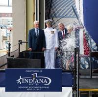 Ship's Sponsor Diane Donald christens the Virginia-class submarine Indiana (SSN 789), witnessed by (from left) Vice President Mike Pence, Indiana's  Commanding Officer, Cdr. Jesse Zimbauer and Newport News Shipbuilding President Matt Mulherin. (U.S. Navy photo courtesy Huntington Ingalls Industries by Ashley Major)