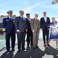 Ship’s sponsor Kay Webber Cochran smashes a bottle of sparkling wine against the bow of the Ingalls-built National Security Cutter Kimball (WMSL 756). Also pictured (left to right) are U.S. Coast Guard Commandant Adm. Paul Zukunft; Mississippi Gov. Phil Bryant; Rep. Steven Palazzo, R-Miss.; Sen. Thad Cochran, R-Miss.; and Ingalls Shipbuilding President Brian Cuccias. (Photo by Lance Davis/HII)
