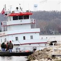 Stephen L. Colby sank Monday after striking a submerged object on the Mississippi River in LeClaire, Iowa. Photo: Kevin E. Schmidt / AP
