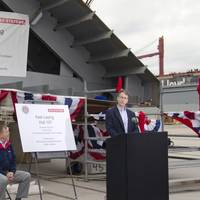 Steve Becker, vice president of Great Lakes Dredge & Dock Company, joins Victor Rhoades (seated), director and general manager of BAE Systems Southeast Shipyards, at a recent keel laying ceremony for the first of two dump scows under construction at BAE Systems’ Mobile, Alabama facility.