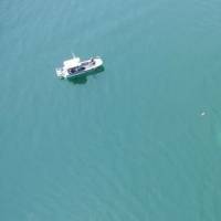 Sunken tugboat just visible: Photo courtesy of USCG
