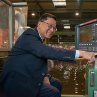 Tan Sri Lim Kok Thay pushes the button to start the first steel cut (Photo: MV Werften)