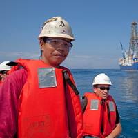 Team members with JOIDES Resolution background: Photo credit IODP Expedition