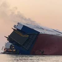 The 656-foot vehicle carrier MV Golden Ray overturned and caught fire in St. Simons Sound on September 8. (Photo: U.S. Coast Guard)