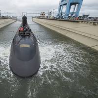 The 7,800-ton Virginia-class submarine John Warner was moved with the help of three tugboats to Newport News Shipbuilding’s submarine pier, where final outfitting, testing and crew certification will take place over the next six months. SSN 785 is the first Virginia-class submarine to be named for a person. Photo by Ricky Thompson/HII