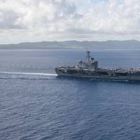 The aircraft carrier USS Theodore Roosevelt (CVN 71) returns to operations in the Philippine Sea on May 21 following an extended visit to Guam in the midst of the COVID-19 global pandemic. (U.S. Navy photo by Kaylianna Genier)