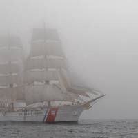 The Coast Guard Cutter Eagle sails through dense fog. U.S. Coast Guard photo by Petty Officer 2nd Class Erik Swanson.