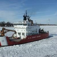 The Coast Guard Cutter Mackinaw, a 240-foot heavy icebreaker, breaks ice near Marine City, Mich., along the St. Clair River (Photo: Daniel R. Michelson / U.S. Coast Guard)
