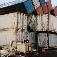 The collapsed row of containers on the barge Ho’omaka Hou in Hilo, Hawaii. (Photo: U.S. Coast Guard.)