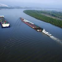 The concept Container on Barge vessel underway on left.
