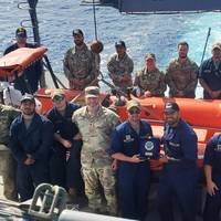 The crew of LCU 2032 Palo Alto display the plaque they received from the Sailors assigned to the Indonesian Navy ship KRI Panah-626 for rescuing an overboard fisherman after his boat capsized boat 10 miles off the western coast of Obi Island, Indonesia Sept. 1, 2023. (Courtesy asset)