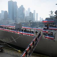 The crew of the Navy’s newest Arleigh Burke-class guided-missile destroyer USS John Basilone (DDG 122) brings the ship to life during the ship's commissioning ceremony in New York City Nov. 9, 2024. (DoD photo by EJ Hersom)