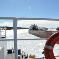 The Cutter Mackinaw comes ahead and creates a track through the ice for the motor vessel James R. Barker (which had become stuck in brash ice) to follow in the vicinity of the Johnson Point Turn in the lower St. Marys River. Photo: USCG
