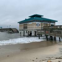 The damaged James T. Wilson fishing pier with debris on the deck of the barge is depicted in this photo taken Nov. 17, 2019. (Photo Credit: U.S. Coast Guard)