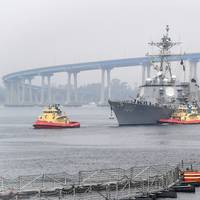 The guided-missile destroyer USS Kidd (DDG 100) arrives in San Diego, April 28, 2020, as part of the Navy's response to the COVID-19 outbreak onboard the ship. While in San Diego, the Navy will provide medical care for the crew and clean and disinfect the ship. (U.S. Navy photo by Alex Millar)