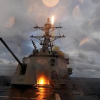 The guided-missile destroyer USS Mustin (DDG 89) fires a Standard Missile 2 missile from the ship's forward and aft missile decks during a missile exercise. Mustin is one of seven guided missile destroyers assigned to Destroyer Squadron 15 and is forward deployed to Yokosuka, Japan. (U.S. Navy photo by Mass Communication Specialist 2nd Class Devon Dow/Released)
