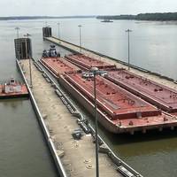 The M/V Steve Golding transits through the Olmsted Locks in late July. Called by some stakeholders, 'the Manhatten Project' of civil engineering, Olmsted is finally completed at an enormous cost. (CREDIT: USACE)
