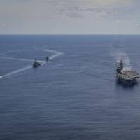 The Nimitz Carrier Strike Group, consisting of flagship USS Nimitz (CVN 68), Ticonderoga-class guided missile cruiser USS Princeton (CG 59), and Arleigh Burke-class guided missile destroyers USS Sterett (DDG 104), and USS Ralph Johnson (DDG 114), along with Indian Navy ships Rana, Sahyardi, Shivalik and Kamorta, steam in formation during a cooperative deployment in the Indian Ocean July 20. (U.S. Navy photo by Jose Madrigal)