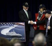 The Secretary of the Navy (SECNAV) the honorable Ray Mabus shakes hands with retired Navy Capt. Mark Kelly, husband of former U.S. Rep. Gabrielle Giffords, from Arizona, at the Pentagon. Mabus announced that the name of the 10th littoral combat ship, LCS 10, will be USS Gabrielle Giffords. (U.S. Navy photo by Chief Mass Communication Specialist Sam Shavers/Released)