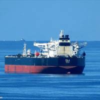 The ship with the mine on the hull has been identified as the Liberia-flagged Pola, and is owned by Dynacom Tankers. Image Credit: Max Wei
