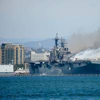 The USS Bonhomme Richard (LHD 6) burns while moored at Naval Base San Diego on July 12, 2020. Photo: John J. Mike / (U.S. Navy)