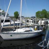 The Wild Irish, a 26-foot sailboat. Kiehm is reported to be on the boat in Lake Michigan.