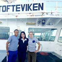 Third Officer Jonalyn Alarin Sabornido (center) pictured with the two USCG Marine Inspectors (Photo: Wallem)