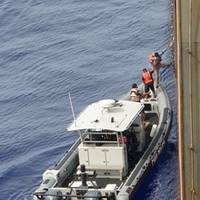 Those rescued being transferred to U.S. Coast Guard vessel. Photo courtesy NYK