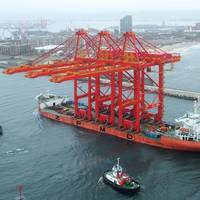 Three mega-sized harbour cranes arriving in the Port of Durban onboard the Zhen Hua 27 vessel.  Photo by Roy Reed