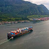 Tugs escort a container vessel to Fairview Container Terminal