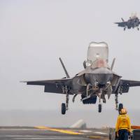 Two F-35B Lightning II fighter aircraft from Marine Fighter Attack Squadron (VMFA) 242, prepare to land on the flight deck of the forward-deployed amphibious assault ship USS America (LHA 6) while conducting flight operations in the Philippine Sea, June 1. America, lead ship of the America Amphibious Ready Group, is operating in the U.S. 7th Fleet area of operations. U.S. 7th Fleet is the U.S. Navy’s largest forward-deployed numbered fleet, and routinely interacts and operates with allies and pa