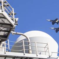 Two F/A-18E Super Hornet, attached to Strike Fighter Squadron (VFA) 151, fly over the Nimitz-class aircraft carrier USS Abraham Lincoln (CVN 72). Abraham Lincoln, flagship of Carrier Strike Group Three, is underway conducting routine operations in the U.S. 7th Fleet area of operations. U.S. 7th Fleet is the U.S. Navy’s largest forward-deployed numbered fleet, and routinely interacts and operates with allies and partners in preserving a free and open Indo-Pacific region. (U.S. Navy photo by Mass 