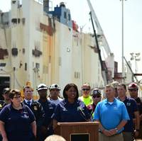 U.S. Coast Guard Capt. Zeita Merchant, the captain of the port and federal on-scene coordinator, addresses in front of the Grande Costa D’Avorio in Port Newark, New Jersey, July 11, 2023. (U.S Coast Guard photo by Petty Officer 3rd Class Mikaela McGee)