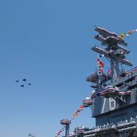 U.S. Navy fighter aircraft perform a flyover at the conclusion of the commissioning ceremony of the aircraft carrier USS Ronald Reagan (CVN-76). (U.S. Navy photo by Rusty Black)
