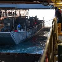 U.S. Navy Sailors aboard the amphibious dock landing ship USS Ashland (LSD-48), moor a landing craft, utility during amphibious operations, off the coast of Okinawa, Japan, in March 2023. (Photo: Christopher R. Lape / U.S. Marine Corps)