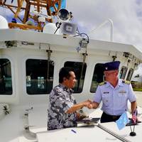 USCG Forces Micronesia Sector Guam Commander Capt. Nicholas R. Simmons and Joses R. Gallen, Secretary of Justice, Federated States of Micronesia, signed an expanded shiprider agreement aboard the USCGC Myrtle Hazard (WPC 1139) in Guam, on Oct. 13, 2022. (Photo: Sara Muir / U.S. Coast Guard)